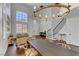 Dining room area showcasing modern decor, wood floors, a chandelier, and natural light at 1754 Quiver Point Ave, Henderson, NV 89012