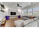 Spacious living room featuring a ceiling fan and large windows for natural light at 1754 Quiver Point Ave, Henderson, NV 89012