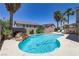 Sparkling pool with rock waterfall and lush landscaping at 1754 Quiver Point Ave, Henderson, NV 89012