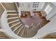 Elegant spiral staircase leading to an open floor plan, dining area, and inviting seating arrangement at 1754 Quiver Point Ave, Henderson, NV 89012