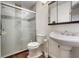 Contemporary bathroom with a glass-enclosed shower, pedestal sink, and modern fixtures at 1939 Dry Falls St, Las Vegas, NV 89142