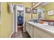 Bathroom featuring dual sinks, ample counter space, and a sunflower-themed shower curtain at 1939 Dry Falls St, Las Vegas, NV 89142