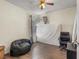 Comfortable bedroom featuring a beanbag chair, wood-look floors, and a window at 1939 Dry Falls St, Las Vegas, NV 89142