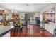 Spacious dining area featuring hardwood floors, a large table, and sliding glass doors to the outdoor area at 1939 Dry Falls St, Las Vegas, NV 89142