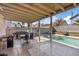 Covered patio featuring a grill and outdoor seating perfect for backyard entertaining at 1939 Dry Falls St, Las Vegas, NV 89142