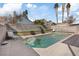 Backyard pool with a jacuzzi and lounge chairs for relaxing in the sun at 1939 Dry Falls St, Las Vegas, NV 89142