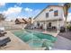 Inviting pool with a hot tub, patio area, and lush landscaping at 1939 Dry Falls St, Las Vegas, NV 89142