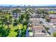 Beautiful aerial view of a Las Vegas neighborhood with houses, trees, and city skyline in the distance at 2032 Jesse Scott St, Las Vegas, NV 89106