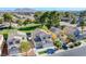 Aerial view of a residential area featuring well-kept lawns, mature trees, and neighborhood parks at 2032 Jesse Scott St, Las Vegas, NV 89106