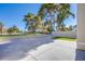 Spacious backyard features gravel landscaping, a concrete patio, and a low brick wall at 2032 Jesse Scott St, Las Vegas, NV 89106