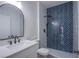 Modern bathroom showcasing herringbone tile in the shower, a sleek vanity, and contemporary black fixtures at 2032 Jesse Scott St, Las Vegas, NV 89106