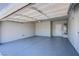 Clean, spacious two-car garage with epoxy flooring, an insulated door, and utility hookups at 2032 Jesse Scott St, Las Vegas, NV 89106