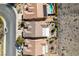 An aerial view of a neighborhood highlighting the rooftops, landscaping, and pool at 2035 King Mesa Dr, Henderson, NV 89012