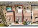 An aerial view shows a house in a desert neighborhood including its perimeter and an adjacent neighbor's pool at 2035 King Mesa Dr, Henderson, NV 89012