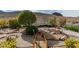 The backyard has unique desert landscaping with small bridge over gravel at 2035 King Mesa Dr, Henderson, NV 89012