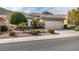 Charming single-story home featuring low-maintenance landscaping and a two-car garage in a desert setting at 2035 King Mesa Dr, Henderson, NV 89012