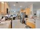 Open kitchen with stainless steel appliances, wood cabinetry, and a view to the adjacent room at 2035 King Mesa Dr, Henderson, NV 89012