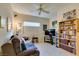 Comfortable living room with a large sofa, bookcase, and a television viewing area at 2035 King Mesa Dr, Henderson, NV 89012