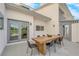 Back patio featuring an outdoor dining table and doors to the interior at 2160 Pueblo Cir, Las Vegas, NV 89169