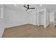 Spacious bedroom with laminate flooring, closet, and bright lighting at 2160 Pueblo Cir, Las Vegas, NV 89169