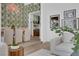 Stylish open concept dining room with modern furnishings and botanical wallpaper that enhance the room at 2160 Pueblo Cir, Las Vegas, NV 89169