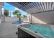 Relaxing backyard with a hot tub and a partial view of a swimming pool at 2160 Pueblo Cir, Las Vegas, NV 89169