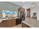 Bright kitchen with stainless steel appliances, granite countertops, and view of backyard at 2160 Pueblo Cir, Las Vegas, NV 89169