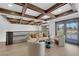 Open living area with a coffered ceiling, balcony, and modern furniture at 2160 Pueblo Cir, Las Vegas, NV 89169