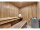 Relaxing sauna featuring wood paneling, built-in benches, and modern heater at 2160 Pueblo Cir, Las Vegas, NV 89169