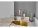 Close up on a sink with gold faucet, glasses, and a decorative cactus at 2160 Pueblo Cir, Las Vegas, NV 89169