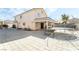 Expansive back yard featuring a covered patio, trampoline, and basketball hoop at 2291 Grannis Ln, Las Vegas, NV 89104