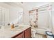 Cozy bathroom featuring a vanity, toilet and shower-tub combo at 2291 Grannis Ln, Las Vegas, NV 89104