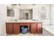 Bathroom with double sink vanity, decorative floor, and separate tub at 2291 Grannis Ln, Las Vegas, NV 89104