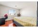 Bedroom with wood floors, neutral walls and a window view at 2291 Grannis Ln, Las Vegas, NV 89104