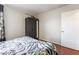 Cozy bedroom featuring a large wardrobe and beautiful laminate flooring at 2291 Grannis Ln, Las Vegas, NV 89104