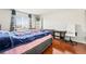 Bedroom with wood floors, a window view, and neutral walls at 2291 Grannis Ln, Las Vegas, NV 89104