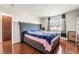 Bedroom featuring neutral walls, wood floors and decorative curtains at 2291 Grannis Ln, Las Vegas, NV 89104