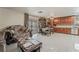 Living room with tile floor alongside the kitchen and dining area at 2291 Grannis Ln, Las Vegas, NV 89104