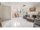 Bright and airy living room with modern tile flooring and a cozy sectional sofa at 2291 Grannis Ln, Las Vegas, NV 89104