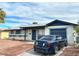 Single-story home with a well-kept front yard and a car parked outside the attached garage at 2609 Sierra Madre Dr, Las Vegas, NV 89102