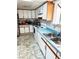 Kitchen featuring stainless steel appliances, including a refrigerator, microwave, and a sink under window at 2609 Sierra Madre Dr, Las Vegas, NV 89102