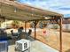 Inviting covered patio with furniture, barbecue, and a view of the spacious backyard at 2609 Sierra Madre Dr, Las Vegas, NV 89102