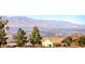 Expansive city view from this home featuring mature shade trees and roof with solar panels at 2702 Grand Forks Rd, Henderson, NV 89052