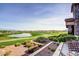 Golf course view overlooking lush greens, blue pond, and beautiful desert landscaping from this home's patio at 2702 Grand Forks Rd, Henderson, NV 89052