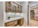 Charming home office area featuring custom cabinets, countertops, and ample storage, leading into the nearby kitchen at 2702 Grand Forks Rd, Henderson, NV 89052