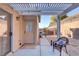 Relaxing covered patio features a grill and outdoor seating, complemented by a landscaped yard at 2728 Goldcreek St, Henderson, NV 89052