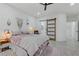 Bright bedroom boasts a stylish sliding door to the bathroom and light-filled ambiance at 2728 Goldcreek St, Henderson, NV 89052