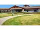 Scenic clubhouse view featuring lush landscaping, a paved walkway, and inviting architecture at 2728 Goldcreek St, Henderson, NV 89052