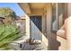 Charming front door with decorative trim, complemented by lush landscaping, and a welcoming entrance at 2728 Goldcreek St, Henderson, NV 89052