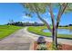 Scenic view of a golf course and pond with trees and clear blue sky at 2728 Goldcreek St, Henderson, NV 89052